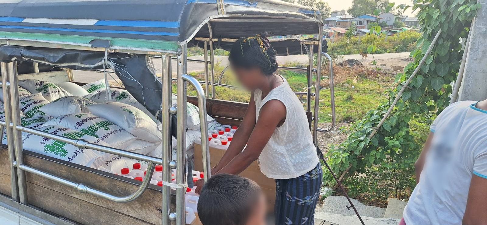 Believers loading the vehicle with groceries and preparing for distribution 